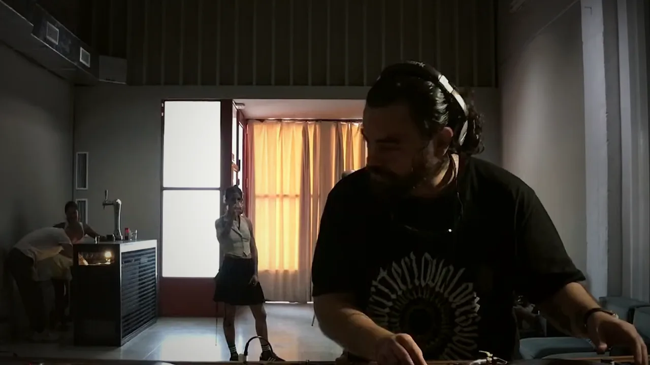 Playing vinyl on the decks during the session at PNC Radio