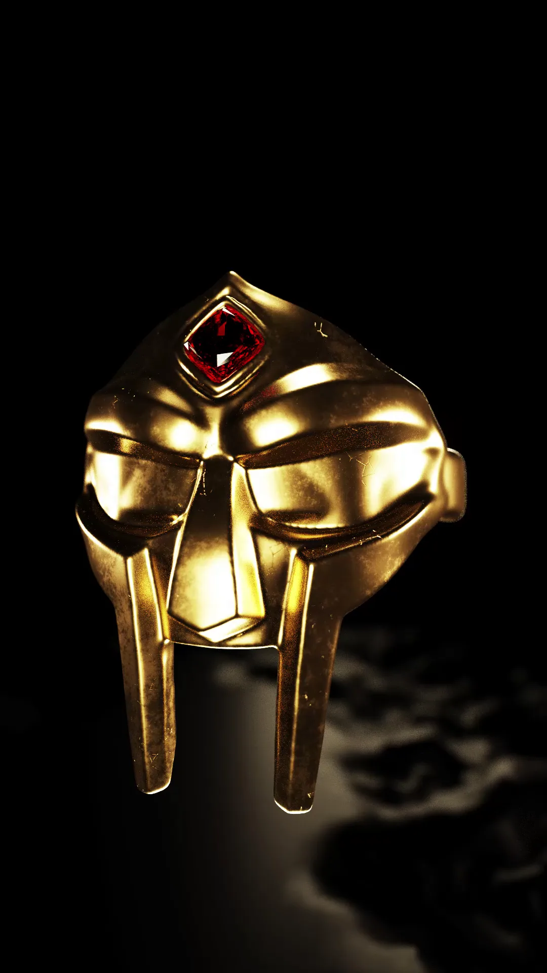 Gold signet ring modelled as the MF DOOM mask, turning under a hard light